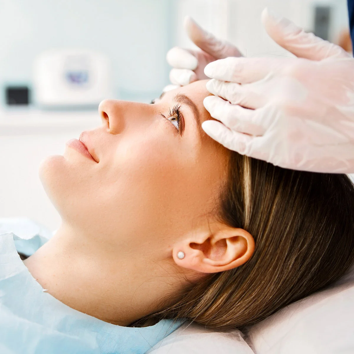 Woman getting a chemical peel to her forehead