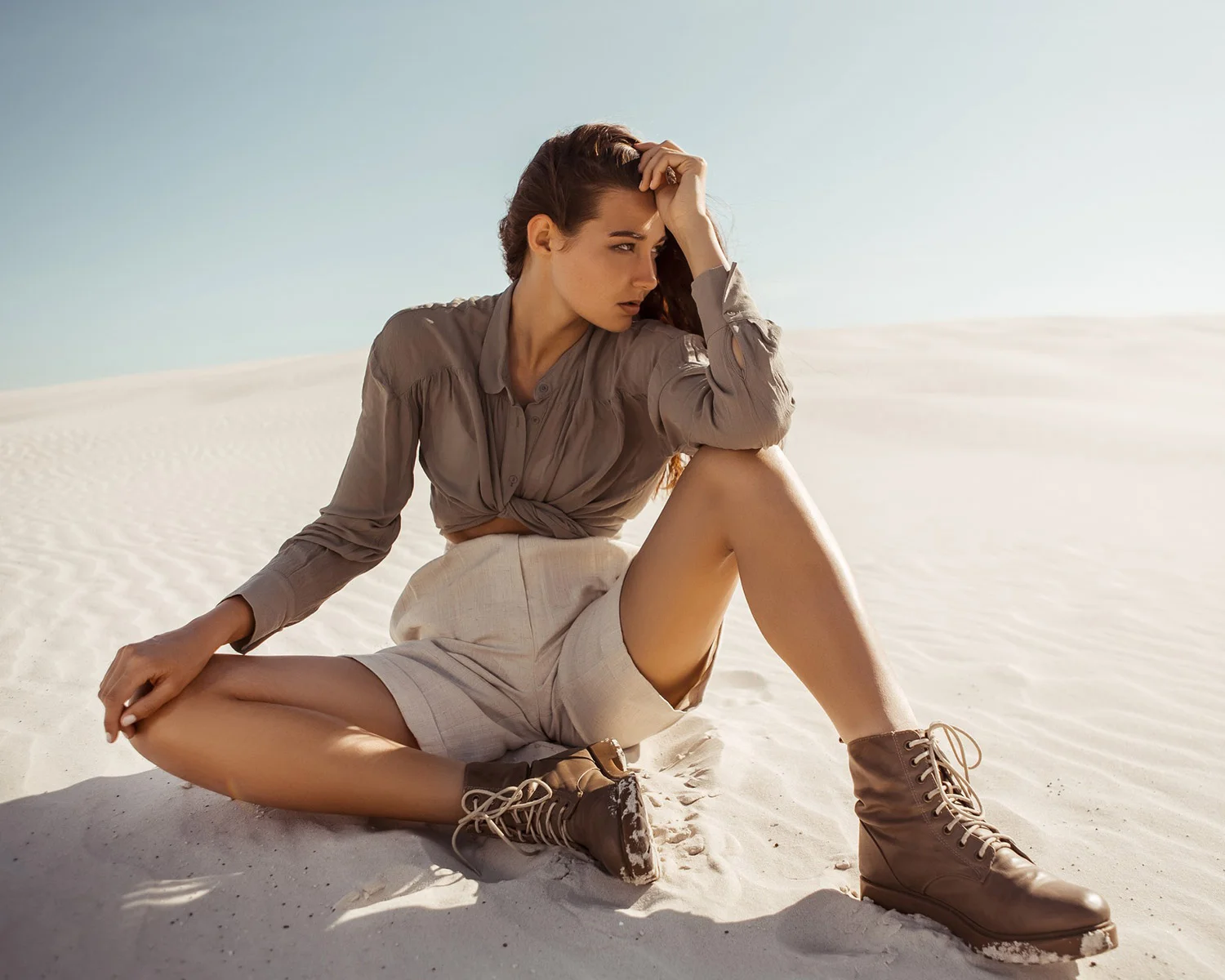 Woman posing on white sand dunes