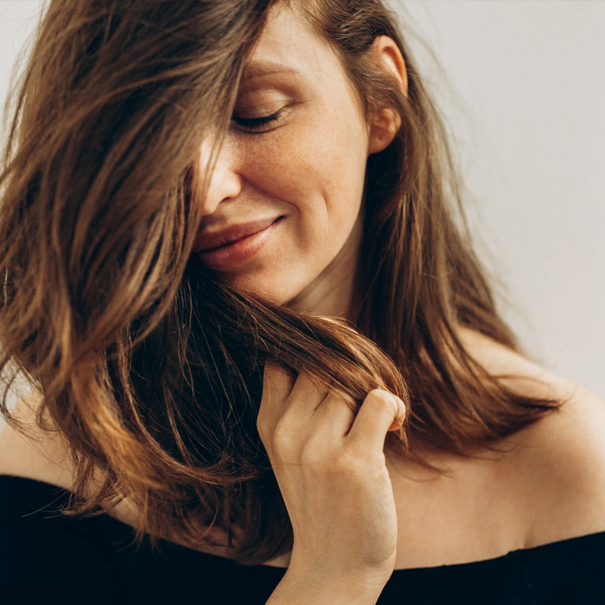 Woman stroking her long hair